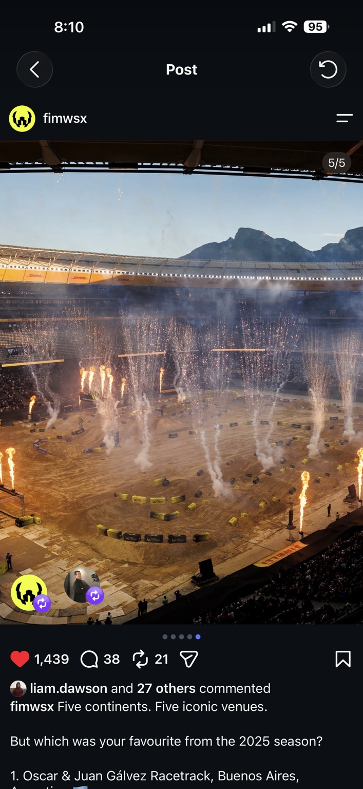 World Supercross stadium track with pyrotechnics and mountain backdrop